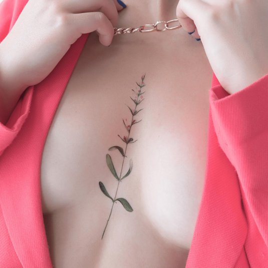 Тату веточка под грудью