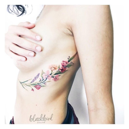 Тату веточка под грудью