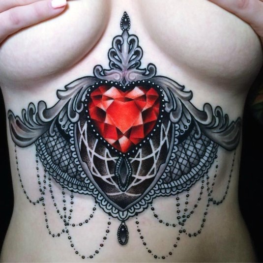 Женская тату на груди